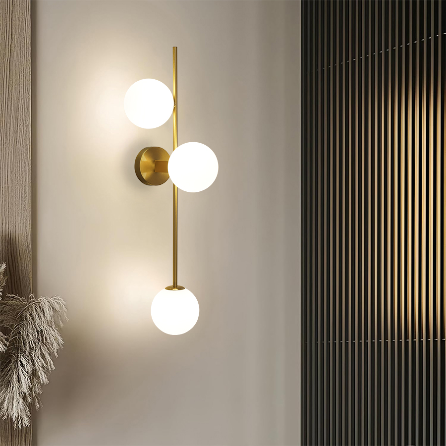 Gold metal wall light with three satin white glass spheres V719